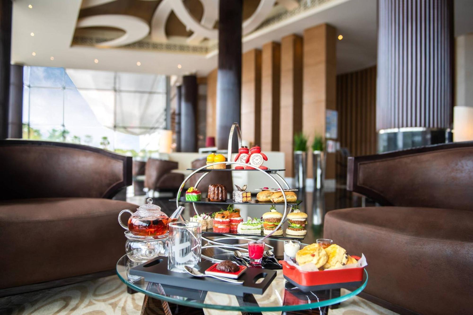 Marriott Hotel Al Forsan, Abu Dhabi Exterior foto Afternoon tea at the Park Hyatt, Hyderabad